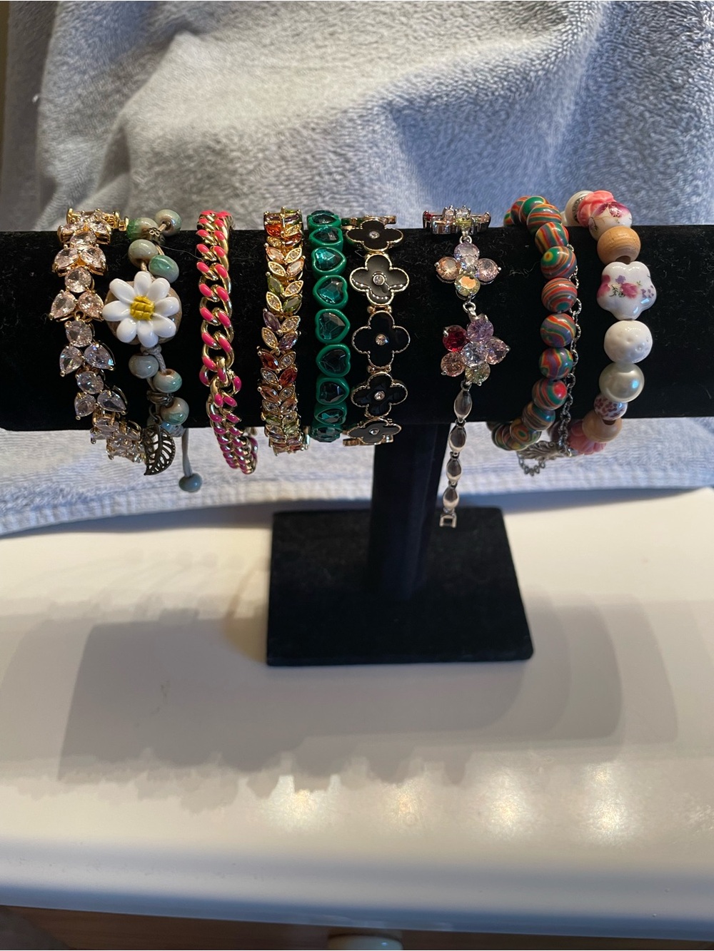 Bundle of 9 bracelets. 5 stretch & 4 clasp.